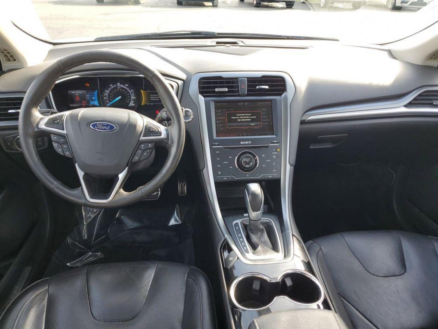 2014 Ingot Silver Metallic /Charcoal Black Ford Fusion Titanium AWD (3FA6P0D93ER) with an 2.0L L4 DOHC 16V engine, 6-speed automatic transmission, located at 6064 Gull Rd, Kalamazoo, MI, 49048, (269) 222-0088, 42.328388, -85.512924 - Discover the perfect blend of style, performance, and comfort with our 2014 Ford Fusion Titanium. This exceptional vehicle is equipped with all-wheel drive, ensuring confident handling and superior traction in all weather conditions. Under the hood, you'll find a robust 4-cylinder, 2.0L engine that - Photo#9