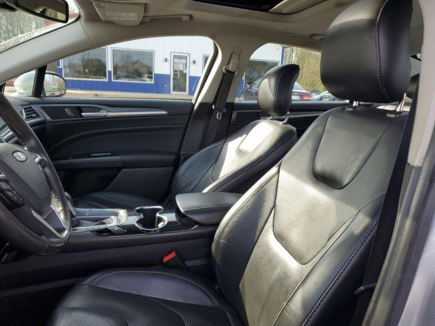 2014 Ingot Silver Metallic /Charcoal Black Ford Fusion Titanium AWD (3FA6P0D93ER) with an 2.0L L4 DOHC 16V engine, 6-speed automatic transmission, located at 6064 Gull Rd, Kalamazoo, MI, 49048, (269) 222-0088, 42.328388, -85.512924 - Discover the perfect blend of style, performance, and comfort with our 2014 Ford Fusion Titanium. This exceptional vehicle is equipped with all-wheel drive, ensuring confident handling and superior traction in all weather conditions. Under the hood, you'll find a robust 4-cylinder, 2.0L engine that - Photo#14