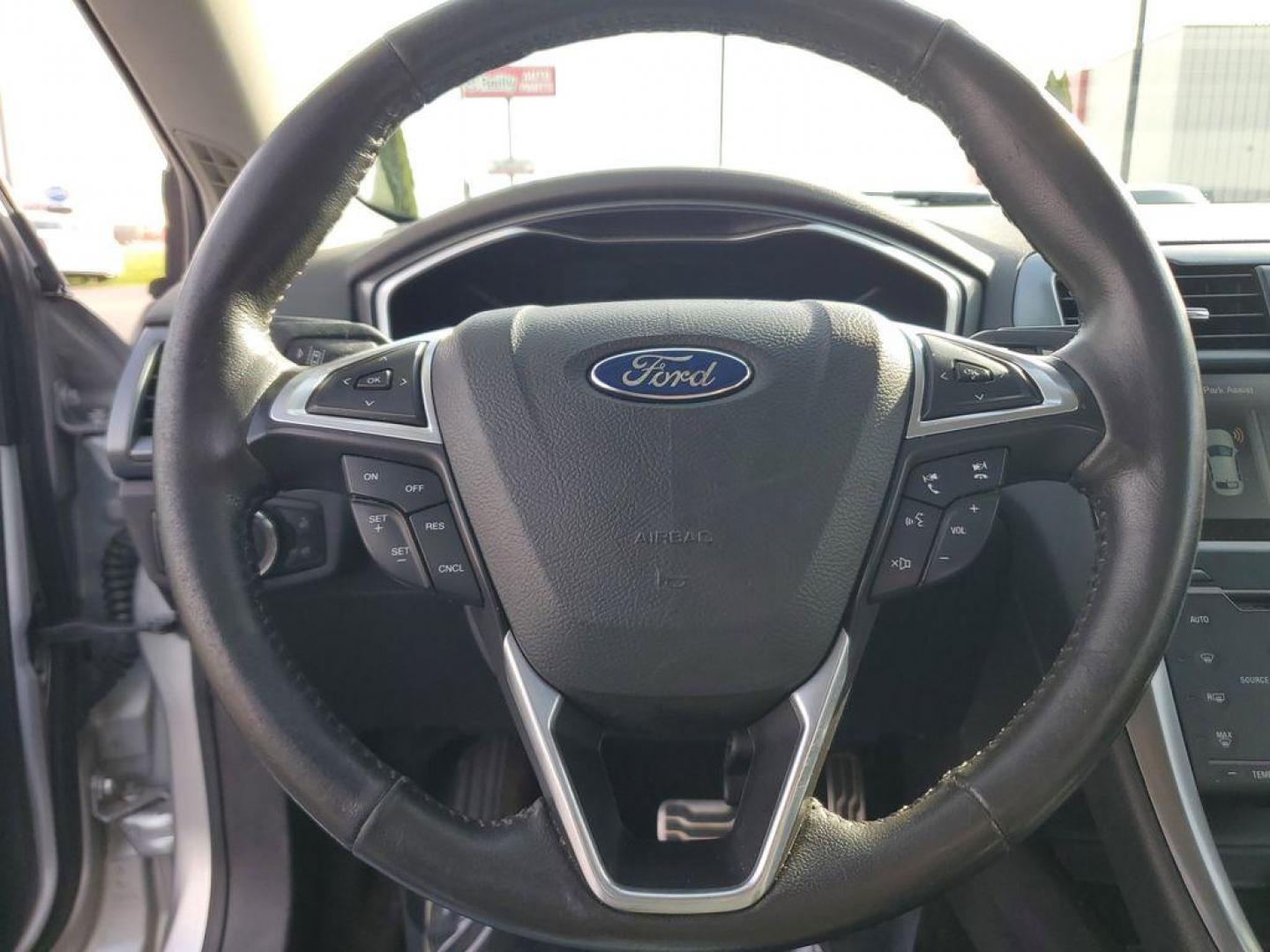 2014 Ingot Silver Metallic /Charcoal Black Ford Fusion Titanium AWD (3FA6P0D93ER) with an 2.0L L4 DOHC 16V engine, 6-speed automatic transmission, located at 6064 Gull Rd, Kalamazoo, MI, 49048, (269) 222-0088, 42.328388, -85.512924 - Discover the perfect blend of style, performance, and comfort with our 2014 Ford Fusion Titanium. This exceptional vehicle is equipped with all-wheel drive, ensuring confident handling and superior traction in all weather conditions. Under the hood, you'll find a robust 4-cylinder, 2.0L engine that - Photo#18