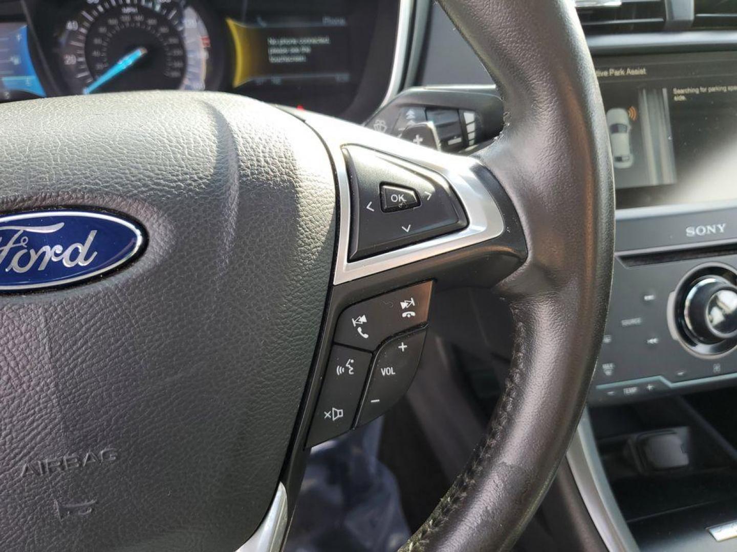 2014 Ingot Silver Metallic /Charcoal Black Ford Fusion Titanium AWD (3FA6P0D93ER) with an 2.0L L4 DOHC 16V engine, 6-speed automatic transmission, located at 6064 Gull Rd, Kalamazoo, MI, 49048, (269) 222-0088, 42.328388, -85.512924 - Discover the perfect blend of style, performance, and comfort with our 2014 Ford Fusion Titanium. This exceptional vehicle is equipped with all-wheel drive, ensuring confident handling and superior traction in all weather conditions. Under the hood, you'll find a robust 4-cylinder, 2.0L engine that - Photo#20