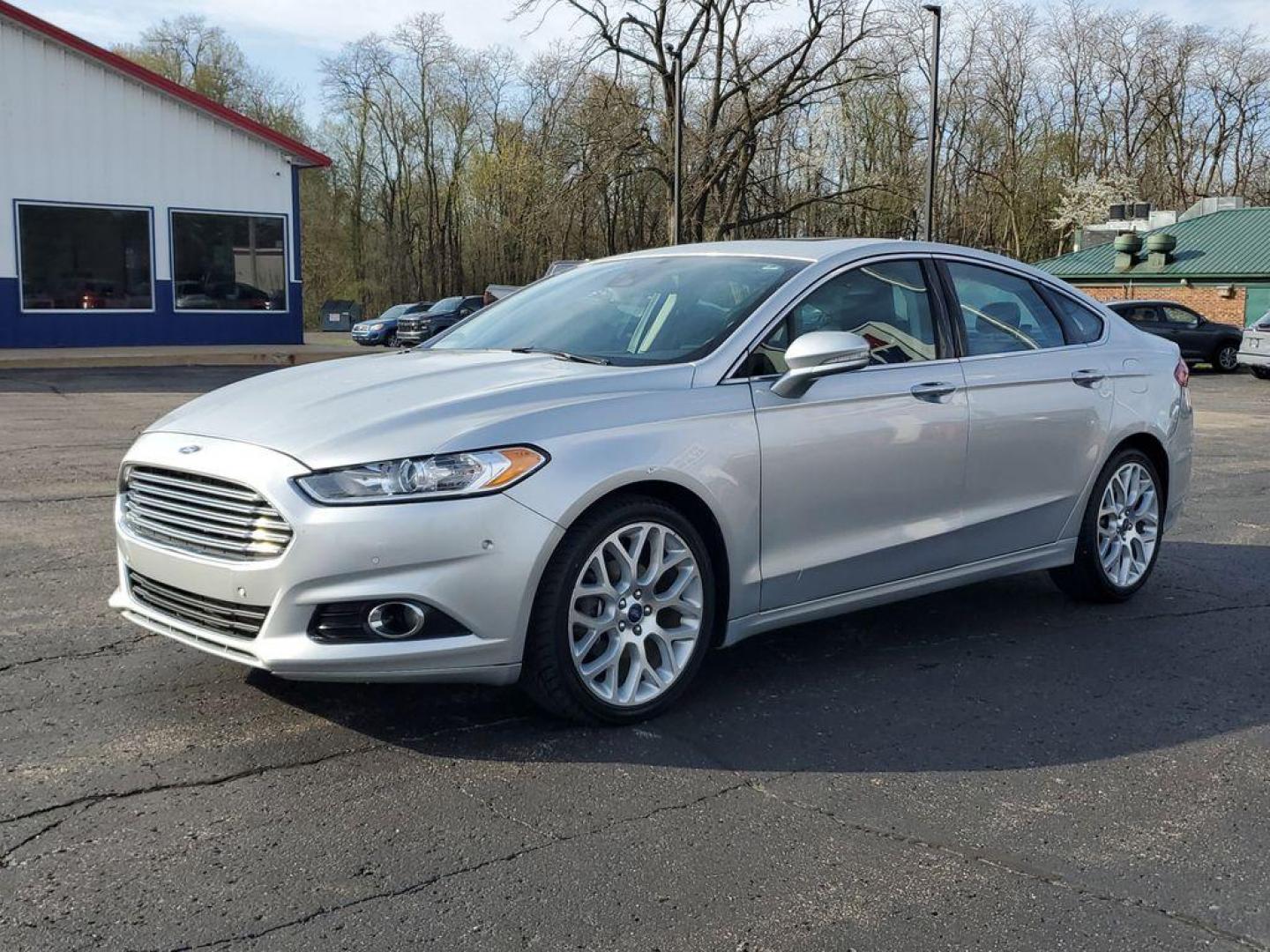 2014 Ingot Silver Metallic /Charcoal Black Ford Fusion Titanium AWD (3FA6P0D93ER) with an 2.0L L4 DOHC 16V engine, 6-speed automatic transmission, located at 6064 Gull Rd, Kalamazoo, MI, 49048, (269) 222-0088, 42.328388, -85.512924 - Discover the perfect blend of style, performance, and comfort with our 2014 Ford Fusion Titanium. This exceptional vehicle is equipped with all-wheel drive, ensuring confident handling and superior traction in all weather conditions. Under the hood, you'll find a robust 4-cylinder, 2.0L engine that - Photo#1