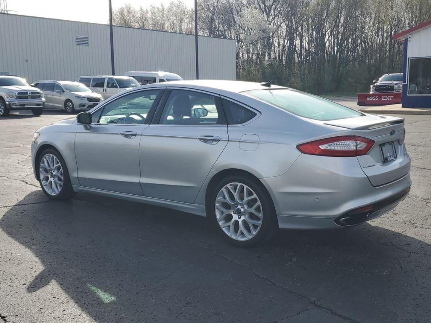 2014 Ingot Silver Metallic /Charcoal Black Ford Fusion Titanium AWD (3FA6P0D93ER) with an 2.0L L4 DOHC 16V engine, 6-speed automatic transmission, located at 6064 Gull Rd, Kalamazoo, MI, 49048, (269) 222-0088, 42.328388, -85.512924 - Discover the perfect blend of style, performance, and comfort with our 2014 Ford Fusion Titanium. This exceptional vehicle is equipped with all-wheel drive, ensuring confident handling and superior traction in all weather conditions. Under the hood, you'll find a robust 4-cylinder, 2.0L engine that - Photo#2
