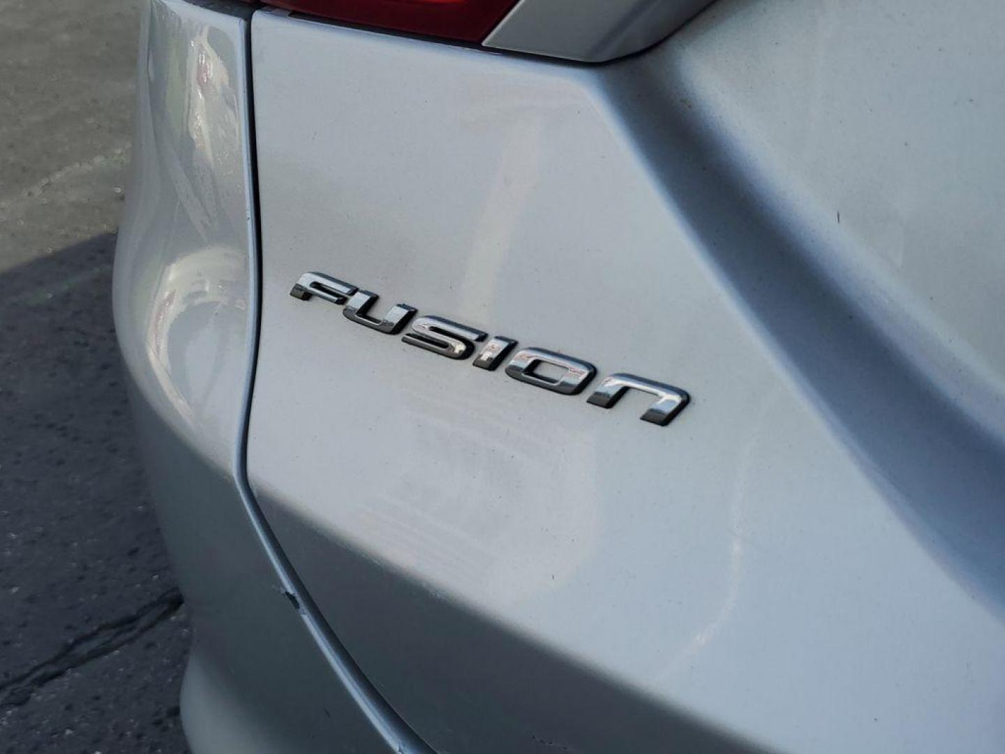 2014 Ingot Silver Metallic /Charcoal Black Ford Fusion Titanium AWD (3FA6P0D93ER) with an 2.0L L4 DOHC 16V engine, 6-speed automatic transmission, located at 6064 Gull Rd, Kalamazoo, MI, 49048, (269) 222-0088, 42.328388, -85.512924 - Discover the perfect blend of style, performance, and comfort with our 2014 Ford Fusion Titanium. This exceptional vehicle is equipped with all-wheel drive, ensuring confident handling and superior traction in all weather conditions. Under the hood, you'll find a robust 4-cylinder, 2.0L engine that - Photo#5