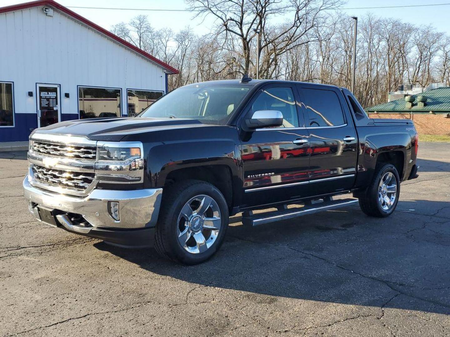 2017 Black /Jet Black Chevrolet Silverado 1500 LTZ Crew Cab Long Box 4WD (3GCUKSEC6HG) with an 5.3L V8 OHV 16V engine, 6A transmission, located at 6064 Gull Rd, Kalamazoo, MI, 49048, (269) 222-0088, 42.328388, -85.512924 - For those seeking a blend of power and luxury, look no further than this exceptional 2017 Chevrolet Silverado 1500 LTZ. This robust pickup combines a commanding V8, 5.3L engine with 4WD capabilities, ensuring you conquer any terrain with confidence. Whether you're navigating city streets or rugged t - Photo#1
