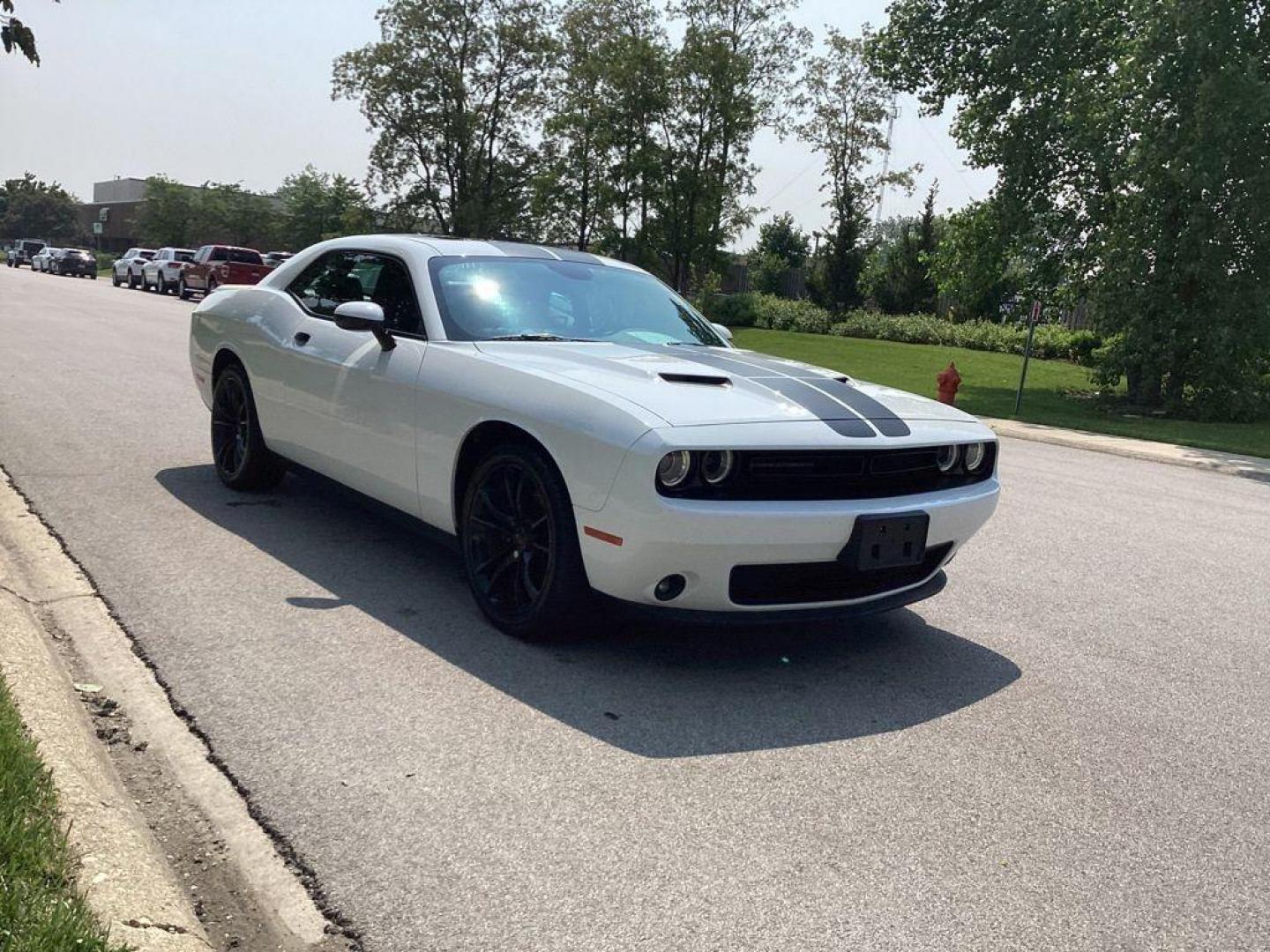 2017 /Black Dodge Challenger SXT (2C3CDZAG6HH) with an 3.6L V6 DOHC 24V engine, 8A transmission, located at 6064 Gull Rd, Kalamazoo, MI, 49048, (269) 222-0088, 42.328388, -85.512924 - <b>Summary</b><br>Power Moonroof<br><br><b>Vehicle Details</b><br>Experience the thrill of driving with this stunning 2017 Dodge Challenger SXT, a true embodiment of power and style. This remarkable vehicle features a robust V6, 3.6L engine paired with rear-wheel drive, offering an exhilarating yet - Photo#10