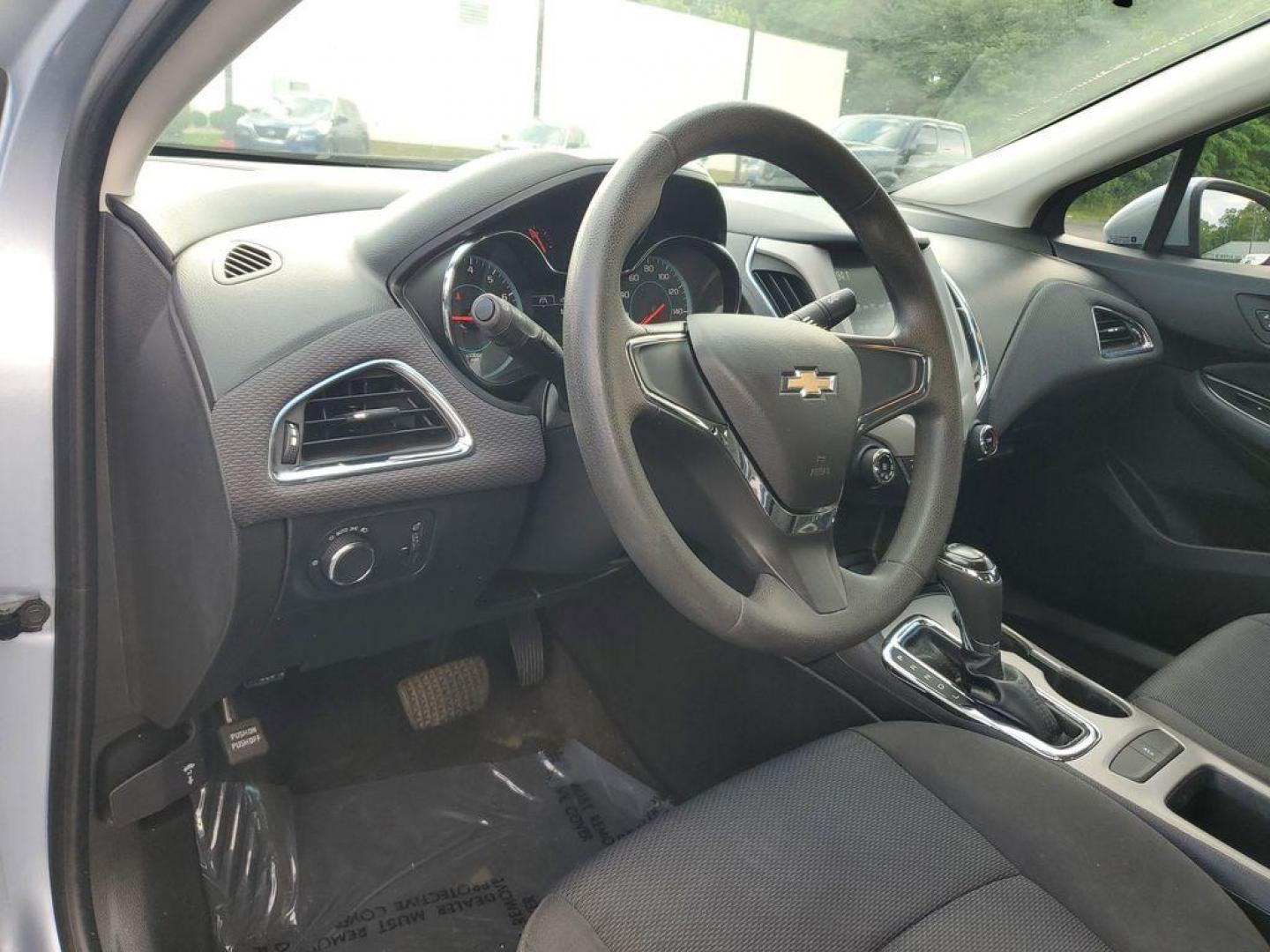 2018 Arctic Blue Metallic /Jet Black Chevrolet Cruze LS Auto (1G1BC5SM1J7) with an 1.4L L4 DOHC 16V TURBO engine, 6A transmission, located at 6064 Gull Rd, Kalamazoo, MI, 49048, (269) 222-0088, 42.328388, -85.512924 - Discover the perfect blend of efficiency, technology, and style with this 2018 Chevrolet Cruze LS. This meticulously maintained vehicle offers front-wheel drive and is powered by a fuel-efficient 1.4L, 4-cylinder engine, making it an ideal choice for both city driving and weekend getaways. <br><br>S - Photo#12
