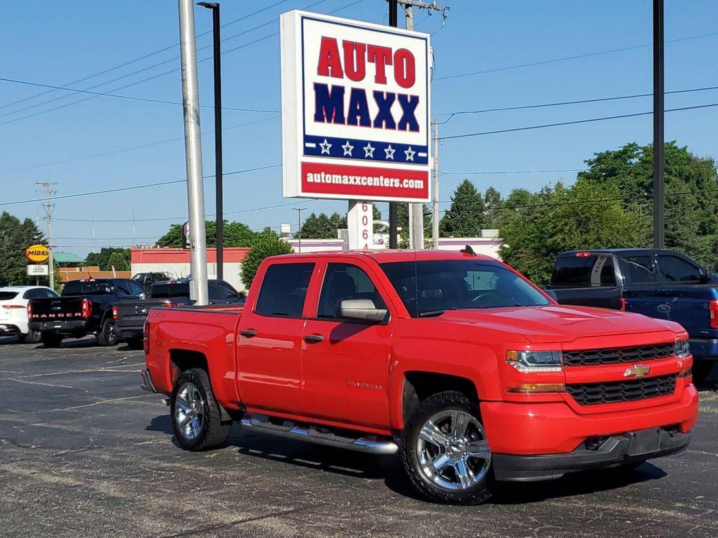 2018 Red Hot /Dark Ash/Jet Black Chevrolet Silverado 1500 Custom Crew Cab 4WD (3GCUKPEC8JG) with an 5.3L V8 OHV 16V engine, 6A transmission, located at 6064 Gull Rd, Kalamazoo, MI, 49048, (269) 222-0088, 42.328388, -85.512924 - For sale: A 2018 Chevrolet Silverado 1500 Custom that perfectly combines power, versatility, and style. This robust truck is equipped with a V8, 5.3L engine, delivering the performance and reliability you need for both work and leisure. Whether you're towing heavy loads or navigating rugged terrain, - Photo#0