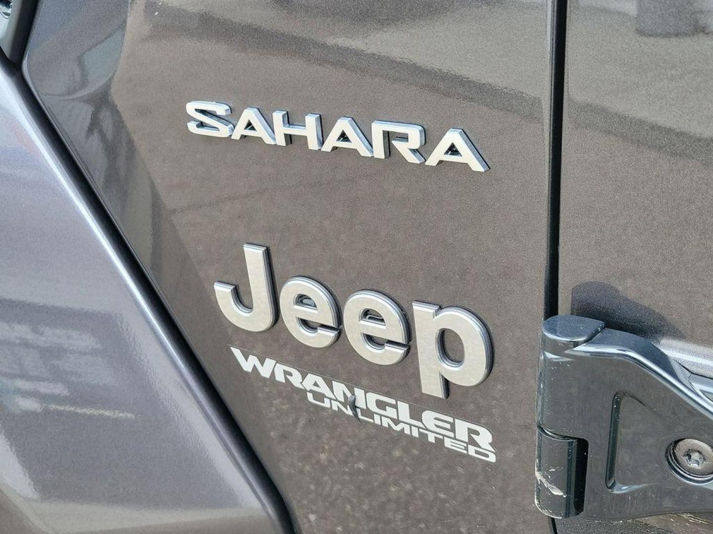 2018 Granite Crystal Metallic Clearcoat /Black Jeep Wrangler JK Unlimited Sahara (1C4HJXEG7JW) with an 3.6L V6 DOHC 24V FFV engine, 6A transmission, located at 234 Columbia Ave, Battle Creek, MI, 49015, (269) 222-0088, 42.298264, -85.192543 - <b>Vehicle Details</b><br>Discover adventure in this 2018 Jeep Wrangler Sahara, a perfect blend of ruggedness and comfort. Equipped with a powerful V6, 3.6L engine and 4WD, this versatile SUV is ready to conquer both city streets and off-road trails. Its classic design is complemented by modern feat - Photo#13