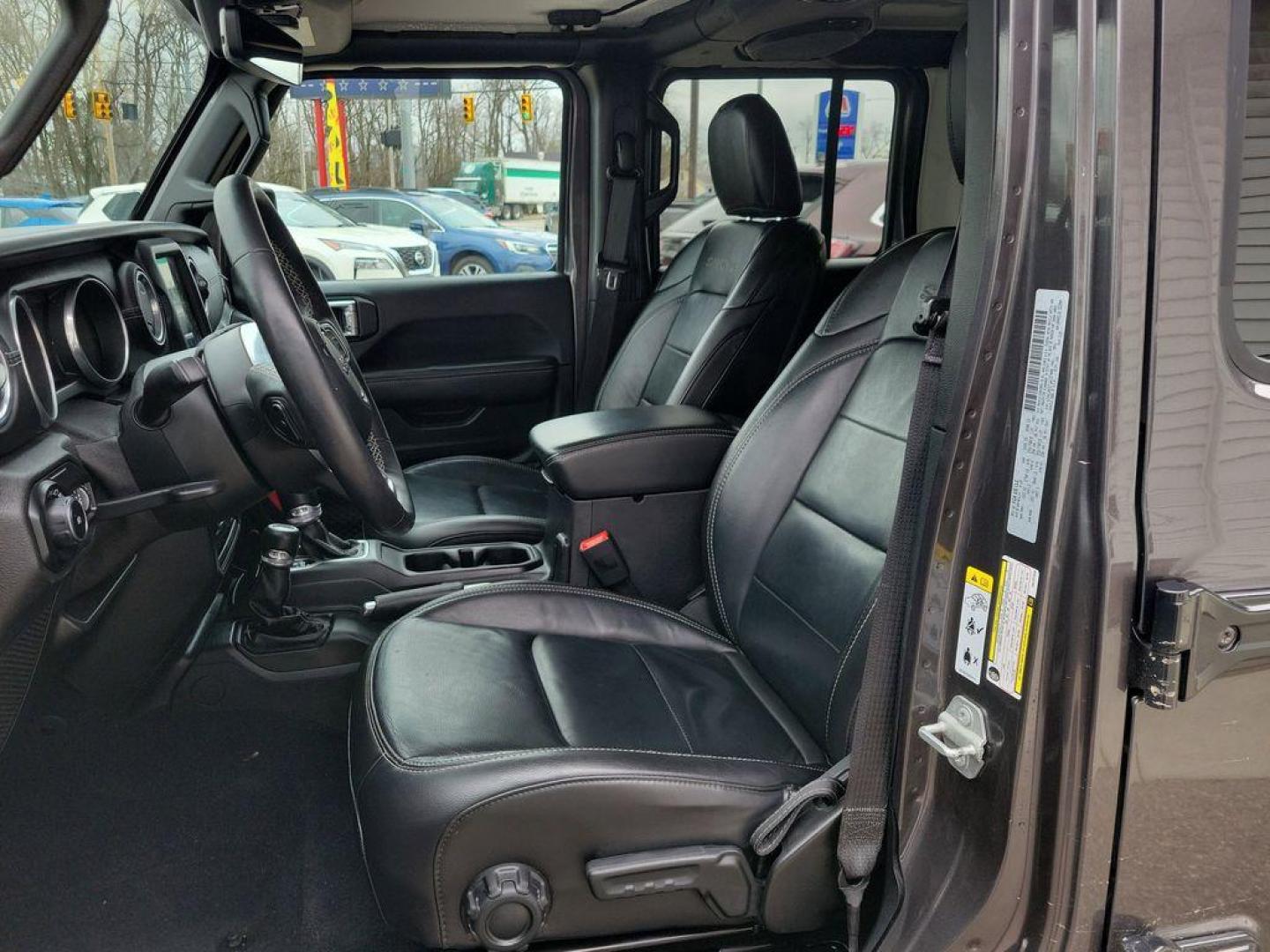 2018 Granite Crystal Metallic Clearcoat /Black Jeep Wrangler JK Unlimited Sahara (1C4HJXEG7JW) with an 3.6L V6 DOHC 24V FFV engine, 6A transmission, located at 234 Columbia Ave, Battle Creek, MI, 49015, (269) 222-0088, 42.298264, -85.192543 - <b>Vehicle Details</b><br>Discover adventure in this 2018 Jeep Wrangler Sahara, a perfect blend of ruggedness and comfort. Equipped with a powerful V6, 3.6L engine and 4WD, this versatile SUV is ready to conquer both city streets and off-road trails. Its classic design is complemented by modern feat - Photo#15
