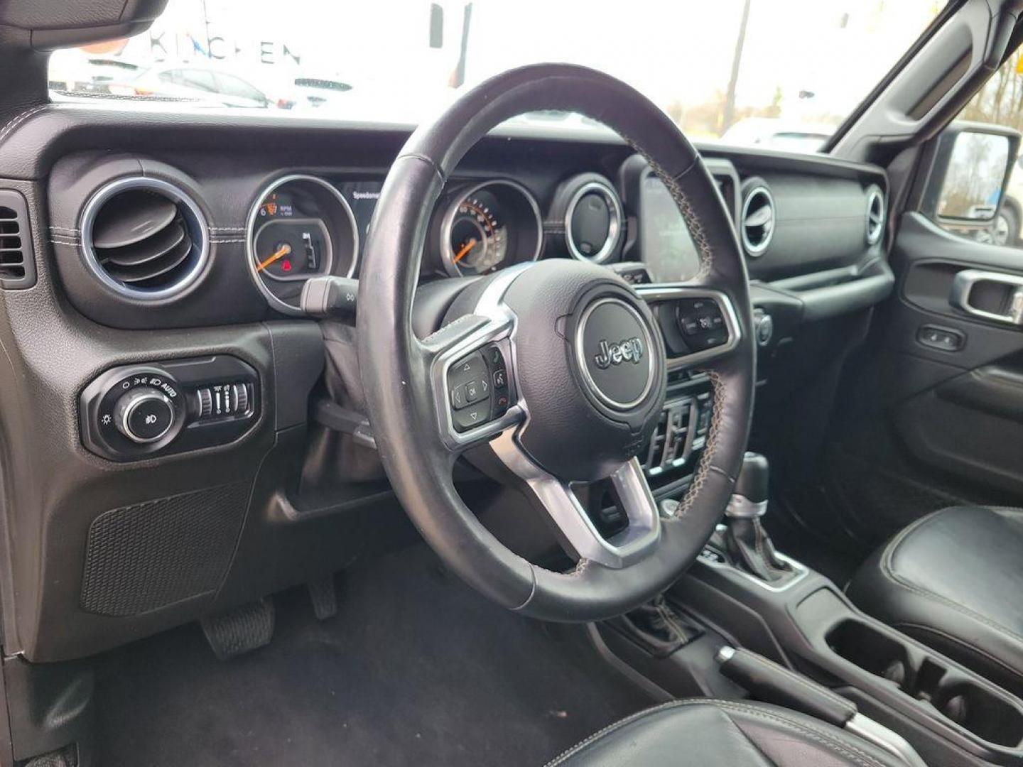 2018 Granite Crystal Metallic Clearcoat /Black Jeep Wrangler JK Unlimited Sahara (1C4HJXEG7JW) with an 3.6L V6 DOHC 24V FFV engine, 6A transmission, located at 234 Columbia Ave, Battle Creek, MI, 49015, (269) 222-0088, 42.298264, -85.192543 - <b>Vehicle Details</b><br>Discover adventure in this 2018 Jeep Wrangler Sahara, a perfect blend of ruggedness and comfort. Equipped with a powerful V6, 3.6L engine and 4WD, this versatile SUV is ready to conquer both city streets and off-road trails. Its classic design is complemented by modern feat - Photo#16