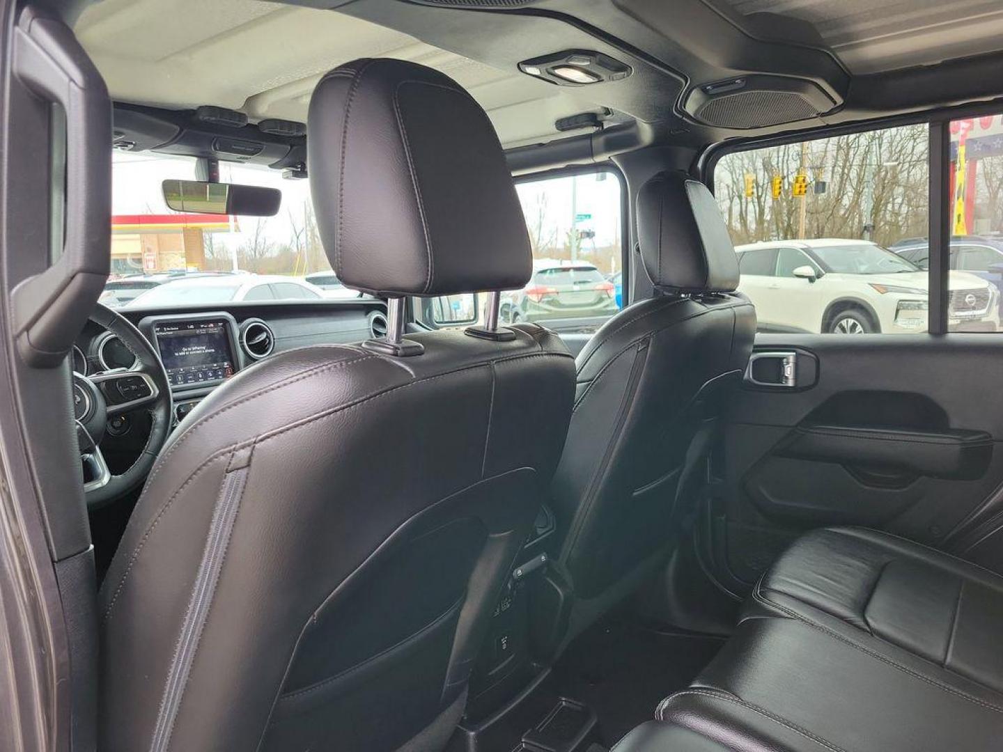 2018 Granite Crystal Metallic Clearcoat /Black Jeep Wrangler JK Unlimited Sahara (1C4HJXEG7JW) with an 3.6L V6 DOHC 24V FFV engine, 6A transmission, located at 234 Columbia Ave, Battle Creek, MI, 49015, (269) 222-0088, 42.298264, -85.192543 - <b>Vehicle Details</b><br>Discover adventure in this 2018 Jeep Wrangler Sahara, a perfect blend of ruggedness and comfort. Equipped with a powerful V6, 3.6L engine and 4WD, this versatile SUV is ready to conquer both city streets and off-road trails. Its classic design is complemented by modern feat - Photo#7