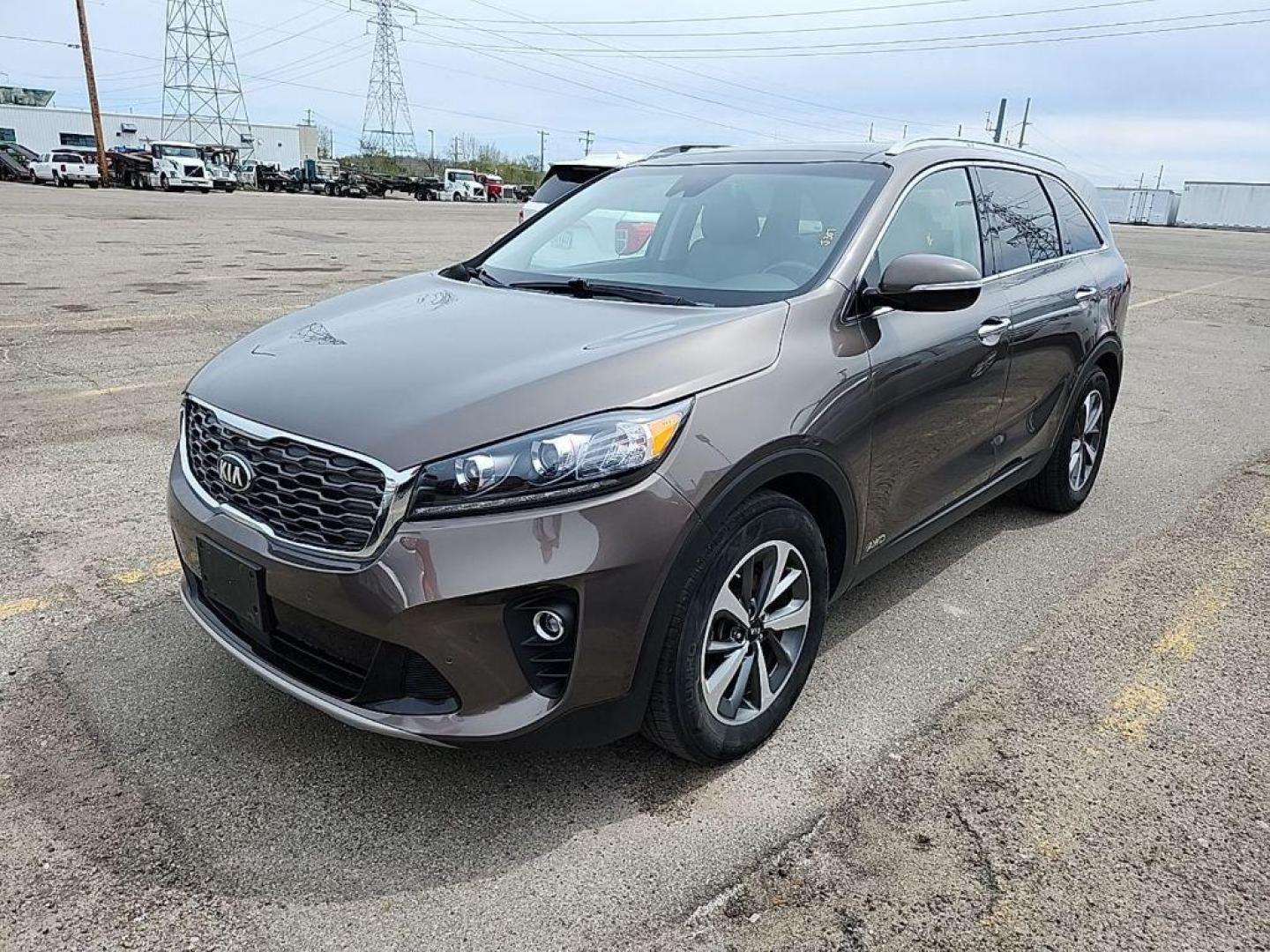 2019 DRAGON BROWN /Satin Black Kia Sorento EX V6 AWD (5XYPHDA5XKG) with an 3.3L V6 DOHC 24V engine, 6A transmission, located at 6064 Gull Rd, Kalamazoo, MI, 49048, (269) 222-0088, 42.328388, -85.512924 - <b>Summary</b><br>NAVIGATION PACKAGE Power Moonroof<br><br><b>Vehicle Details</b><br>Get ready to elevate your driving experience with this stunning 2019 Kia Sorento EX V6 AWD! This versatile SUV is ready to take on any adventure, combining power, style, and advanced features to create the ultimate - Photo#0