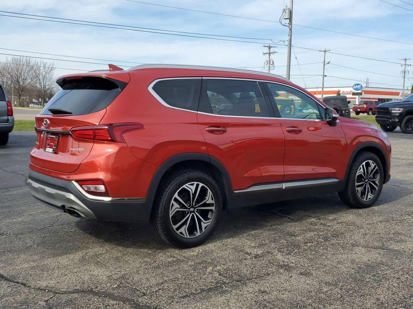 2020 Lava Orange /Espresso/Gray Hyundai Santa Fe Ultimate 2.0T AWD (5NMS5CAA7LH) with an 2.0L L4 DOHC 16V TURBO engine, 6A transmission, located at 6064 Gull Rd, Kalamazoo, MI, 49048, (269) 222-0088, 42.328388, -85.512924 - <b>Summary</b><br>NAVIGATION PACKAGE Power Moonroof<br><br><b>Vehicle Details</b><br>Discover the pristine elegance and unbeatable performance of the 2020 Hyundai Santa Fe Limited, the ultimate vehicle for those who crave adventure without compromising on luxury. With only 0 miles on the odometer, t - Photo#3