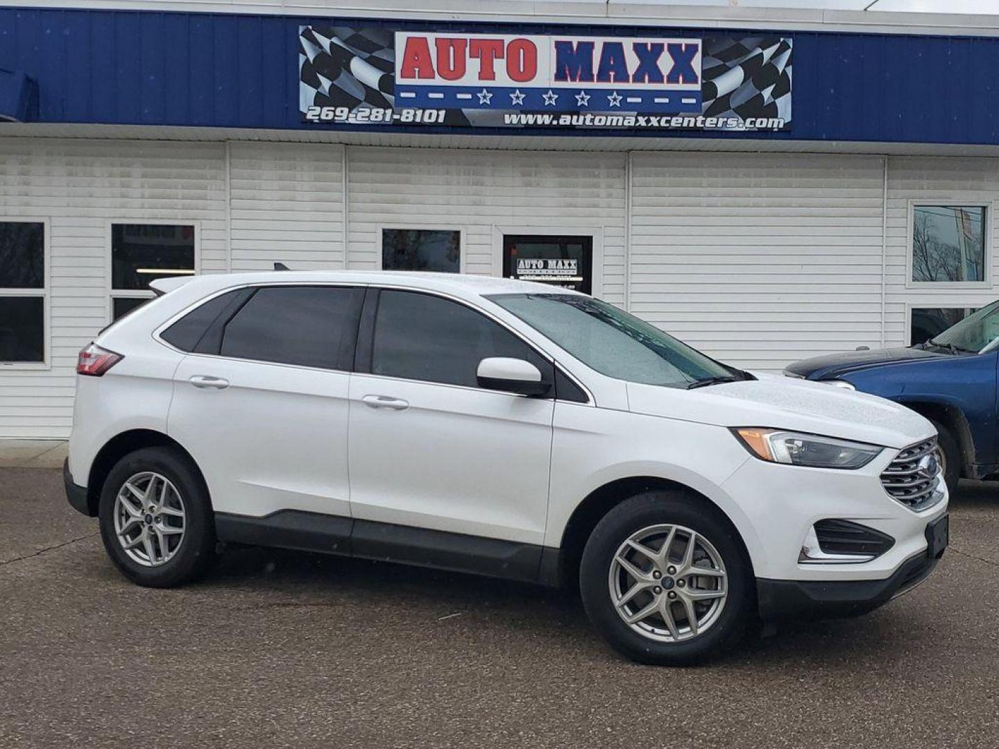 2022 Oxford White /Ebony Ford Edge SEL AWD (2FMPK4J90NB) with an 2.0L L4 DOHC 16V engine, 6A transmission, located at 234 Columbia Ave, Battle Creek, MI, 49015, (269) 222-0088, 42.298264, -85.192543 - Equipment Group 201A: 18" Sparkle Silver-Painted Aluminum Wheels; 3.80 Axle Ratio; ActiveX Seating Material Heated Bucket Seats; 8-Speed Automatic Transmission with SelectShift; Twin-Scroll 2.0L EcoBoost Engine; 245/60R18 AS BSW Tires; TBD GVWR; AM/FM Stereo/MP3 Capable Radio Mini Spare Wheel LED Da - Photo#0