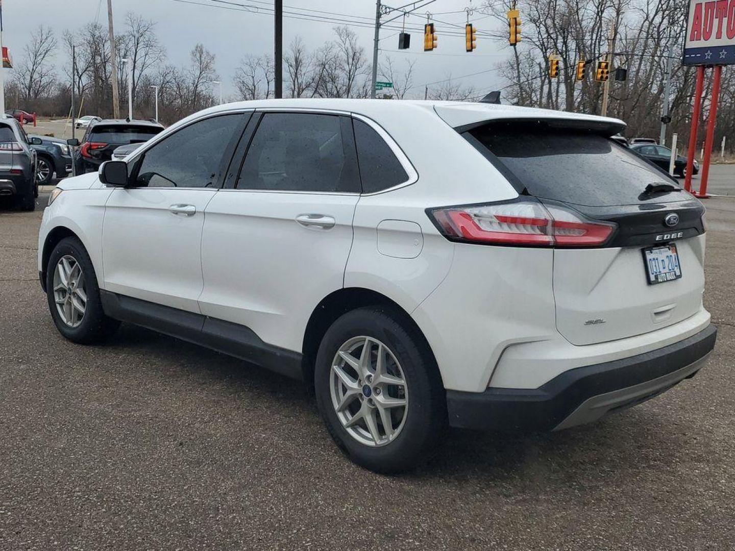 2022 Oxford White /Ebony Ford Edge SEL AWD (2FMPK4J90NB) with an 2.0L L4 DOHC 16V engine, 6A transmission, located at 234 Columbia Ave, Battle Creek, MI, 49015, (269) 222-0088, 42.298264, -85.192543 - Equipment Group 201A: 18" Sparkle Silver-Painted Aluminum Wheels; 3.80 Axle Ratio; ActiveX Seating Material Heated Bucket Seats; 8-Speed Automatic Transmission with SelectShift; Twin-Scroll 2.0L EcoBoost Engine; 245/60R18 AS BSW Tires; TBD GVWR; AM/FM Stereo/MP3 Capable Radio Mini Spare Wheel LED Da - Photo#2