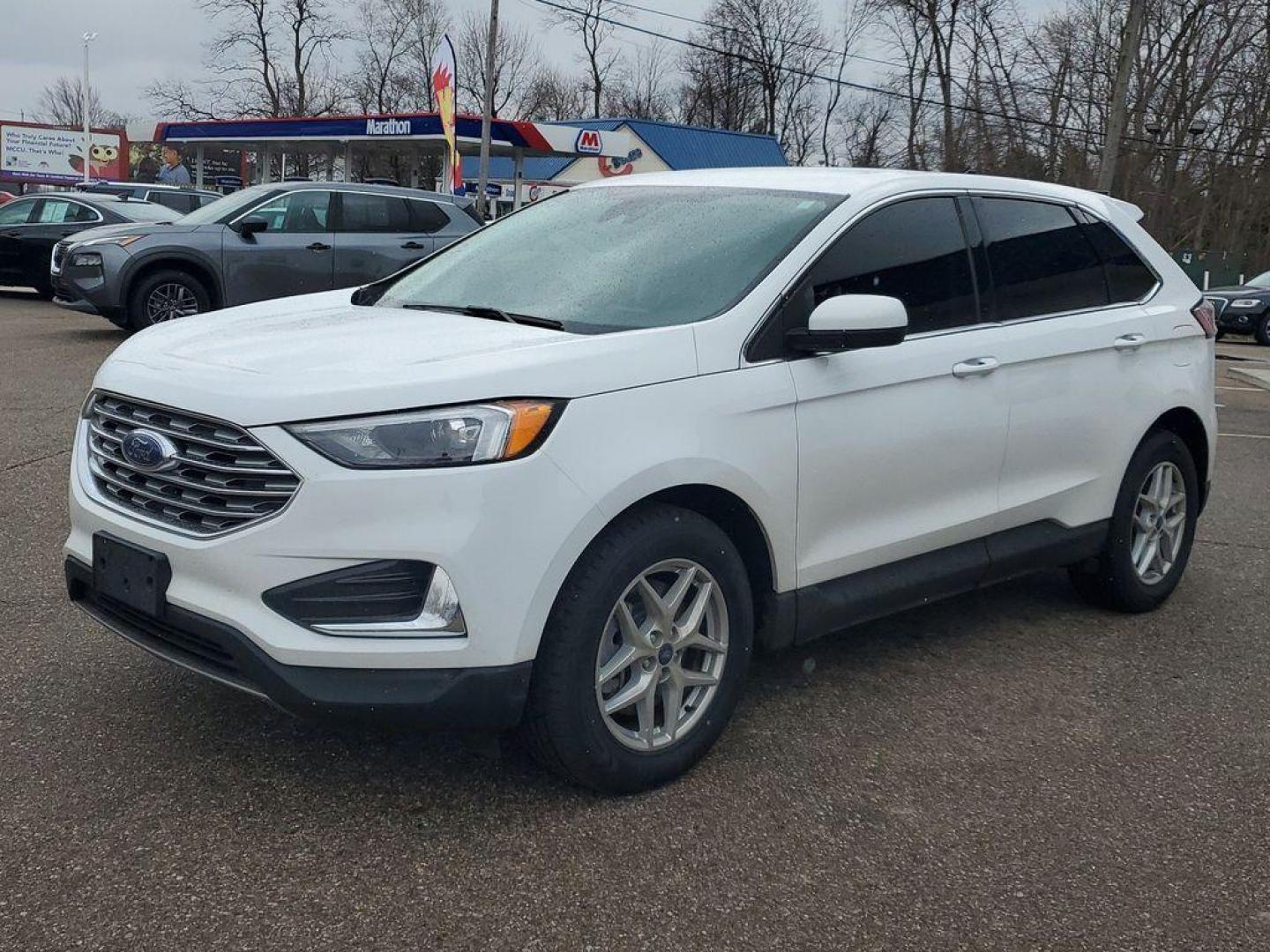 2022 Oxford White /Ebony Ford Edge SEL AWD (2FMPK4J90NB) with an 2.0L L4 DOHC 16V engine, 6A transmission, located at 234 Columbia Ave, Battle Creek, MI, 49015, (269) 222-0088, 42.298264, -85.192543 - Equipment Group 201A: 18" Sparkle Silver-Painted Aluminum Wheels; 3.80 Axle Ratio; ActiveX Seating Material Heated Bucket Seats; 8-Speed Automatic Transmission with SelectShift; Twin-Scroll 2.0L EcoBoost Engine; 245/60R18 AS BSW Tires; TBD GVWR; AM/FM Stereo/MP3 Capable Radio Mini Spare Wheel LED Da - Photo#3