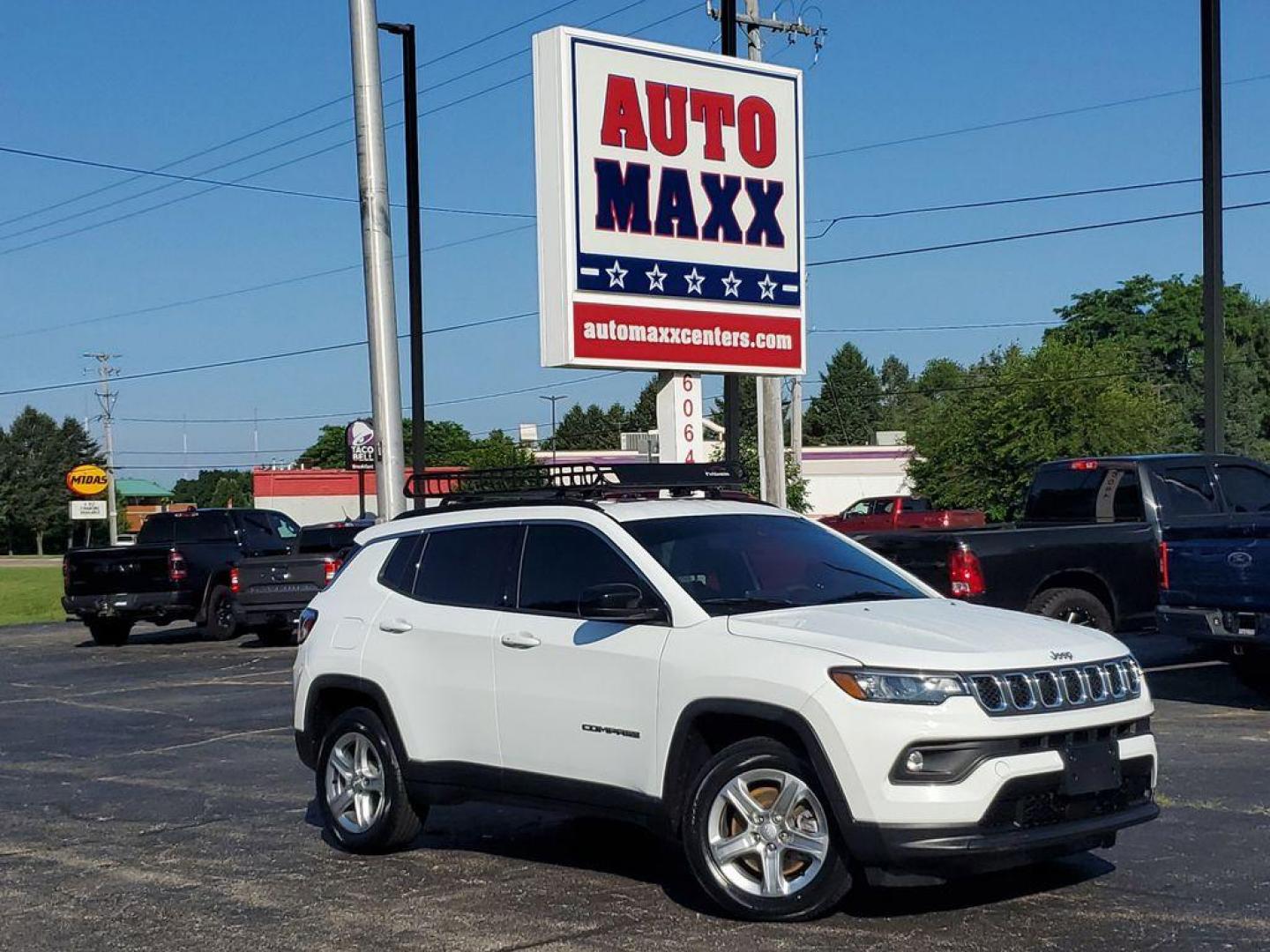 2023 Bright White Clearcoat /BLACK Jeep Compass Latitude (3C4NJDBNXPT) with an 2.0L L4 DOHC 16V TURBO engine, 8-speed automatic transmission, located at 6064 Gull Rd, Kalamazoo, MI, 49048, (269) 222-0088, 42.328388, -85.512924 - Experience the perfect blend of style, performance, and technology with this pre-owned 2023 Jeep Compass Latitude. Equipped with a robust 4-cylinder, 2.0L engine and advanced 4WD capabilities, this vehicle is ready to tackle both city streets and off-road adventures with confidence. The Jeep Compass - Photo#0