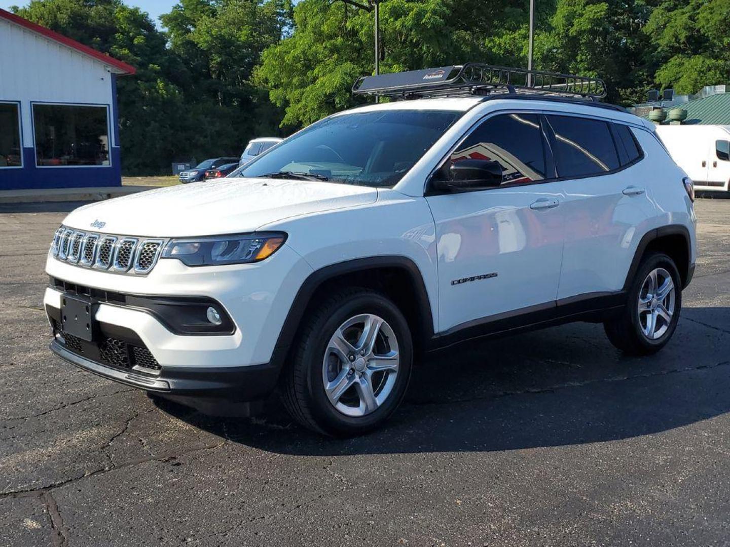 2023 Bright White Clearcoat /BLACK Jeep Compass Latitude (3C4NJDBNXPT) with an 2.0L L4 DOHC 16V TURBO engine, 8-speed automatic transmission, located at 6064 Gull Rd, Kalamazoo, MI, 49048, (269) 222-0088, 42.328388, -85.512924 - Experience the perfect blend of style, performance, and technology with this pre-owned 2023 Jeep Compass Latitude. Equipped with a robust 4-cylinder, 2.0L engine and advanced 4WD capabilities, this vehicle is ready to tackle both city streets and off-road adventures with confidence. The Jeep Compass - Photo#1