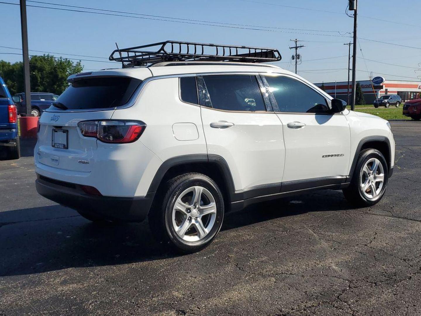 2023 Bright White Clearcoat /BLACK Jeep Compass Latitude (3C4NJDBNXPT) with an 2.0L L4 DOHC 16V TURBO engine, 8-speed automatic transmission, located at 6064 Gull Rd, Kalamazoo, MI, 49048, (269) 222-0088, 42.328388, -85.512924 - Experience the perfect blend of style, performance, and technology with this pre-owned 2023 Jeep Compass Latitude. Equipped with a robust 4-cylinder, 2.0L engine and advanced 4WD capabilities, this vehicle is ready to tackle both city streets and off-road adventures with confidence. The Jeep Compass - Photo#3